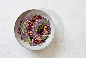 Red cabbage, apples and carrots salad Coleslaw in a bowl