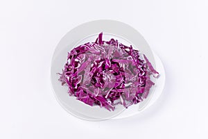 Red cabbage in a bowl isolated on a white background