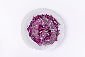 Red cabbage in a bowl isolated on a white background