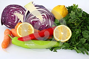 red cabbage, carrot, lemon, pepper, parsley isolated on white background.