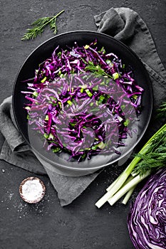 Red cabbage salad with fresh green onion and dill