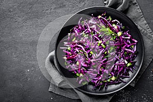 Red cabbage salad with fresh green onion and dill. Vegetarian dish