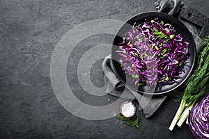 Red cabbage salad with fresh green onion and dill. Vegetarian dish