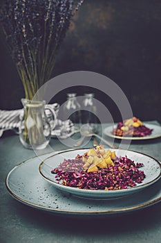 Red cabbage salad with fried apples caramelized with cinnamon