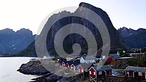 Red cabins on the shore of the Fjord at sunset, Reine, Lofoten Islands, Norway