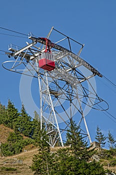 Red cable car in Carpathians mountains