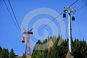 Red cable car and gondola ride transportation at 2000m in Bucegi Mountains, Romania