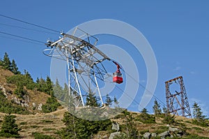 Red cable car in the mountains