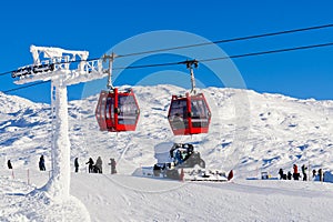 Red cable car in a ski resort in the Alps. Red gondola funicular in a ski resort, sweden, frosty sunny day