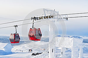 Red cable car in a ski resort in the Alps. Red gondola funicular in a ski resort, sweden, frosty sunny day