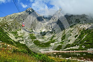 Red cable car from the Tatra Mountains to the Lomnicky Peak. Beautiful mountain landscape in Slovakia.