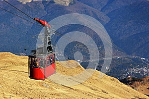 Red cable car transportation at 2000m in Bucegi Mountains, autumn season, Sinaia, Romania