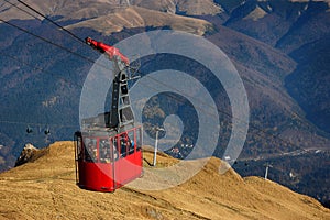 Red cable car transportation at 2000m in Bucegi Mountains, autumn season, Sinaia, Romania