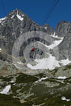 Red cableway rising to the top in High Tatras