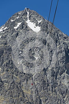 Red cableway rising to the top in High Tatras