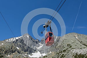 Red cableway rising to the top in High Tatras