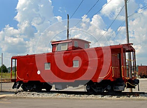 Red Caboose under sunny skies