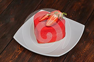 Red cake in the shape of heart on Valentine`s Day