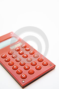 Red calculator on the white background