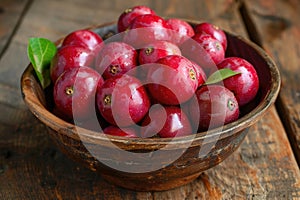 Red camu camu fruit in a bowl. Camu camu is a south American fruit photo