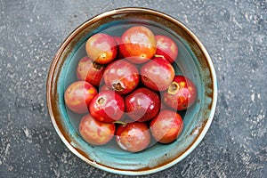 Red camu camu fruit in a bowl. Camu camu is a south American fruit photo