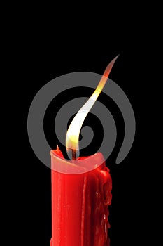 Red candle in black background