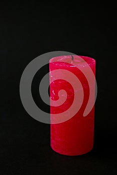 Red candle extinguished on black background. Copy space for text. Romantic.