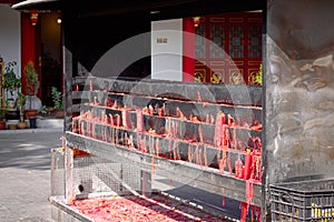 Red candles brazier in the Buddhist Temple