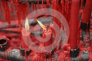 Red candles burning in a Buddhist shrine
