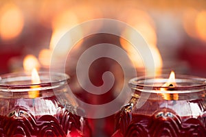 Red candles burning in a chinese buddhist temple