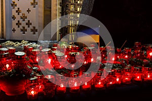 Red candles at night near the holodomor memorial. Honoring the memory of victims of famines in Ukraine