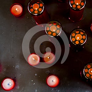 Red candles to remember deceased loved ones