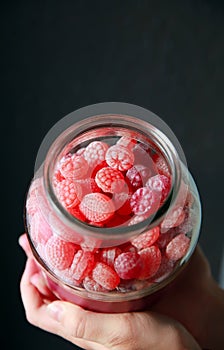 Red candy in a glass candy jar