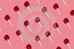Red candy sweet pattern on the pink minimal background