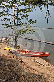 Red canoe on beach