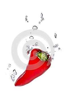 Red capsicum in water with air bubbles