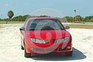 Red car on beach