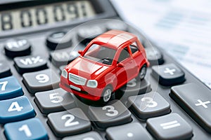 Red car on calculator, auto tax and financing, car insurance and car loans