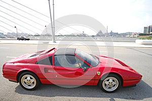 Red Car on Ciment Road