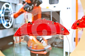 Red car disc brake caliper presented on acrylic glass photo
