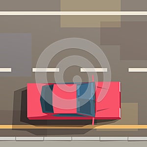 red car driving on road top view