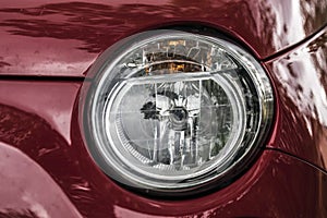 Red car headlights close up