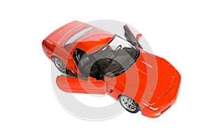 Red car model with open doors isolated on a white background