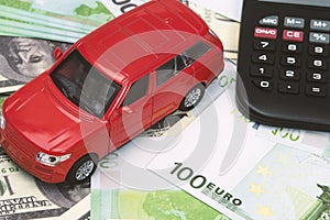 Red car and money, euro and dollars