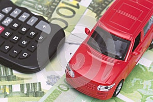 Red car and money, euro and dollars