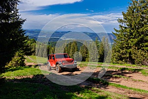 red car in the mountains