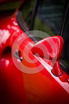 Red car side view mirror