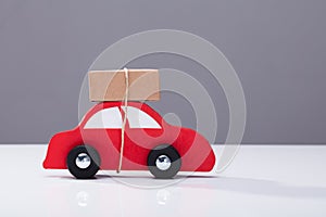 Red Car Transporting Cardboard Box