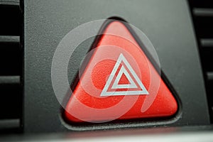 Red car Warning button with a white triangle switching all the vehicle outdoor indicators as a symbol of caution, warning and po
