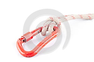 Red carabiner with a white rope